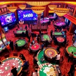 Exciting gameplay at nhà cái jun88 casino with vibrant tables, players, and slot machines.
